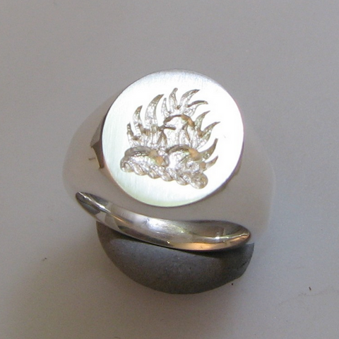 Burning rocks crest trade engraved signet ring