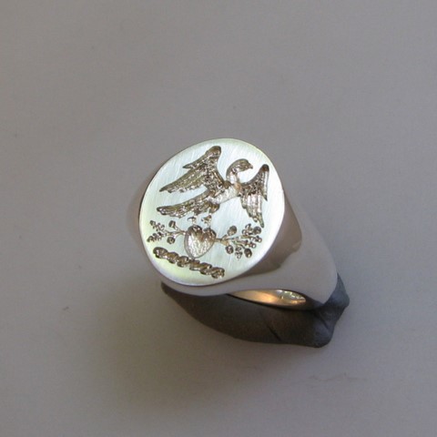 bird on heart crest ring